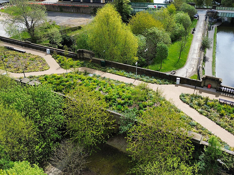 Aerial regenerated landscape photo of Monk Bridge viaduct, with liner green landscape across canal.