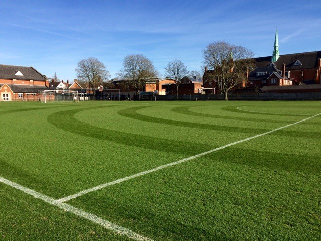 Grounds of a school estate with neatly cut grass and line markings