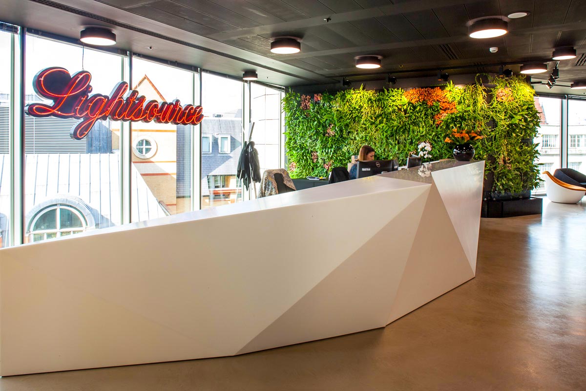 living plant wall in an office reception area