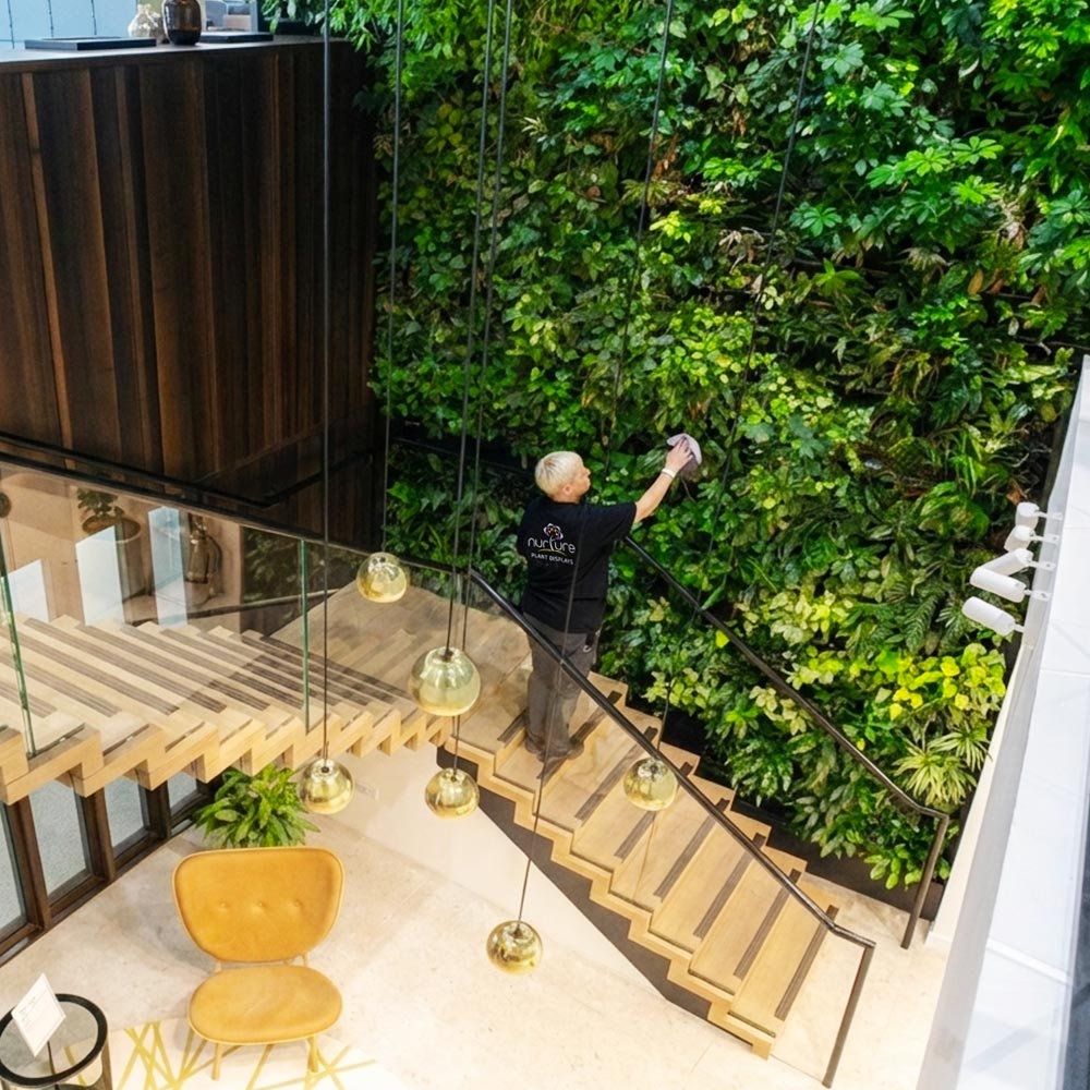 vertical large living plant wall installation in a corporate office
